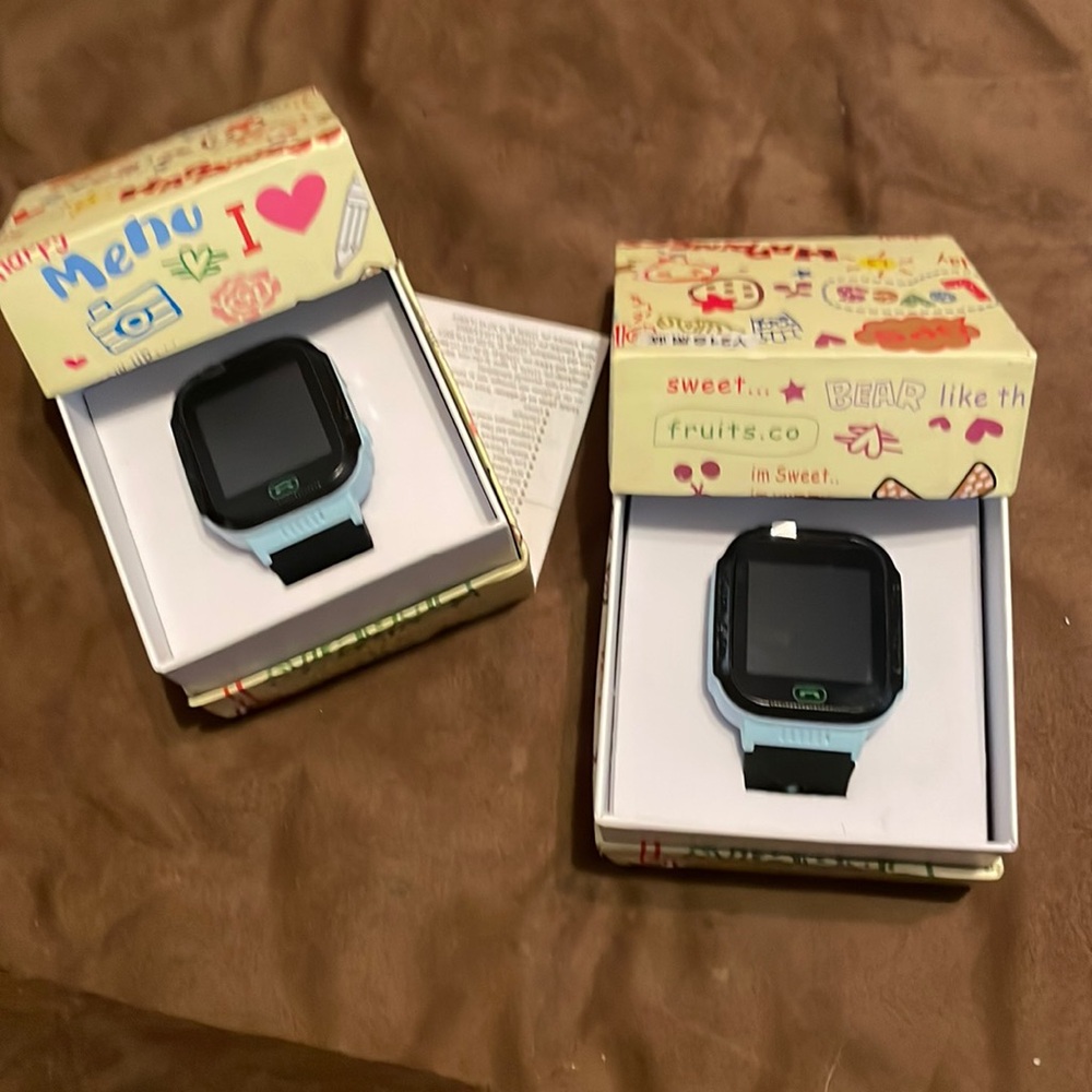 Two blue smart watches for kids
